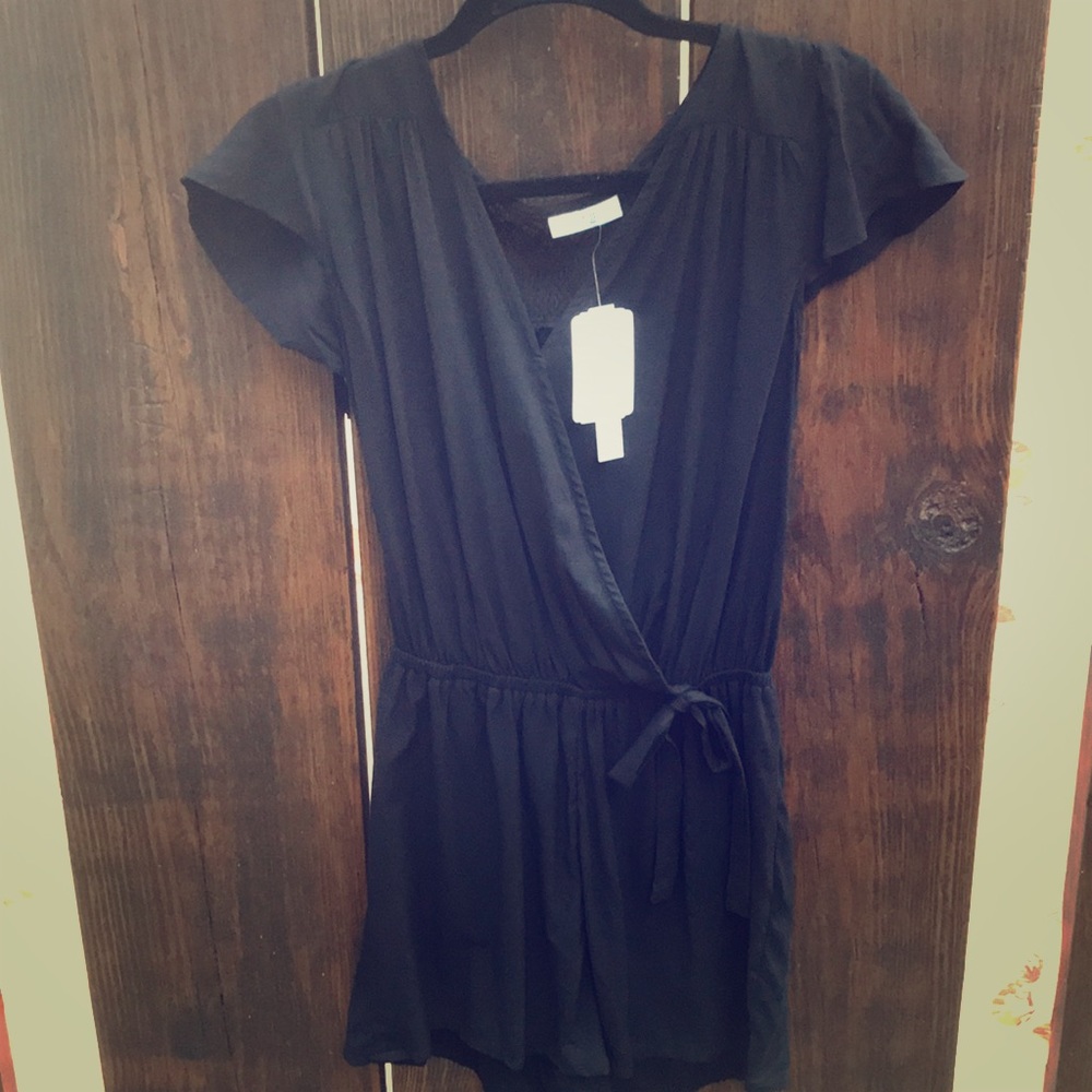 Black romper w/ lace back shoulder area.